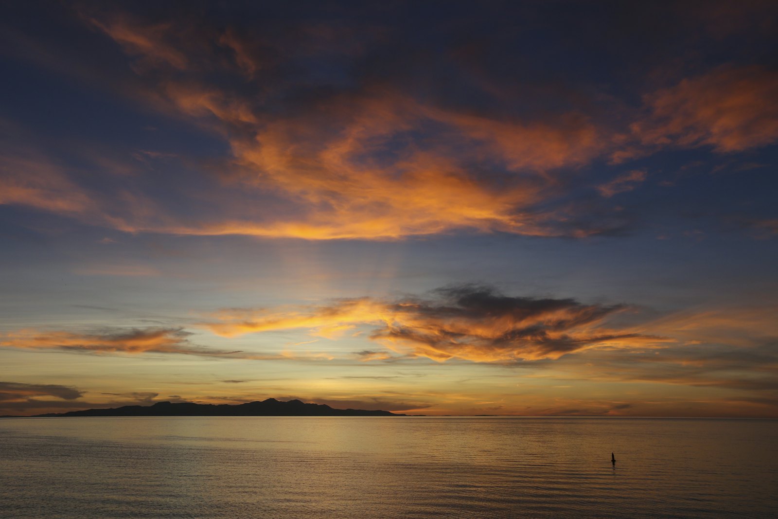 Purple dusk over a quiet bay